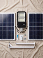Componentes del foco solar LED 200W Nido: foco, panel solar, tubo y control remoto